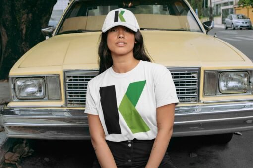 crewneck t shirt mockup of a woman with a dad hat posing in front of an old car 28605
